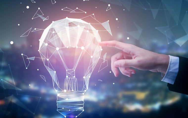 Digital image of hand touching a lightbulb