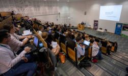 Event room crowd looking at speaker