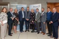 Event group in front of signage