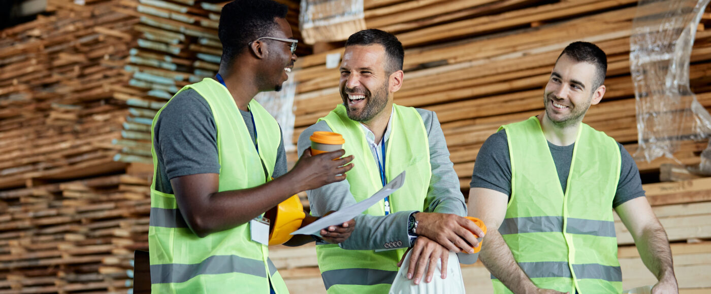 I Stock First Time Exporters 3 smiling warehourse workers drinking coffee