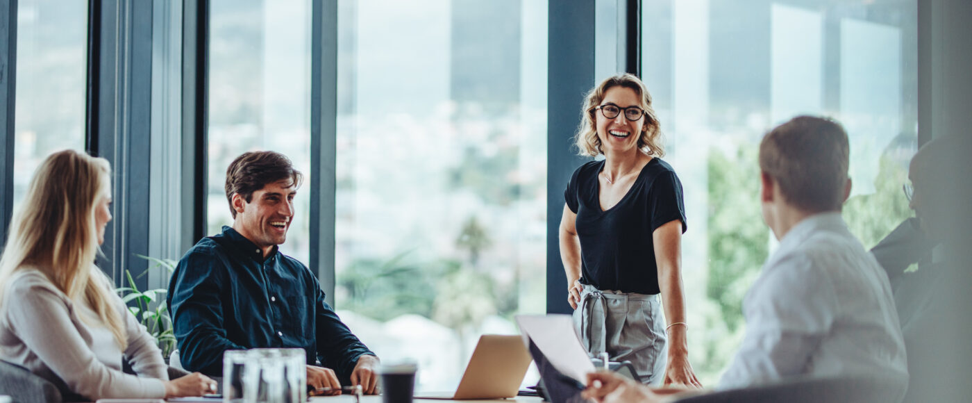 I Stock Innovation Boost smiling work group at table