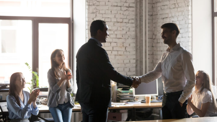 I Stock Explore business greeting with handshake in office