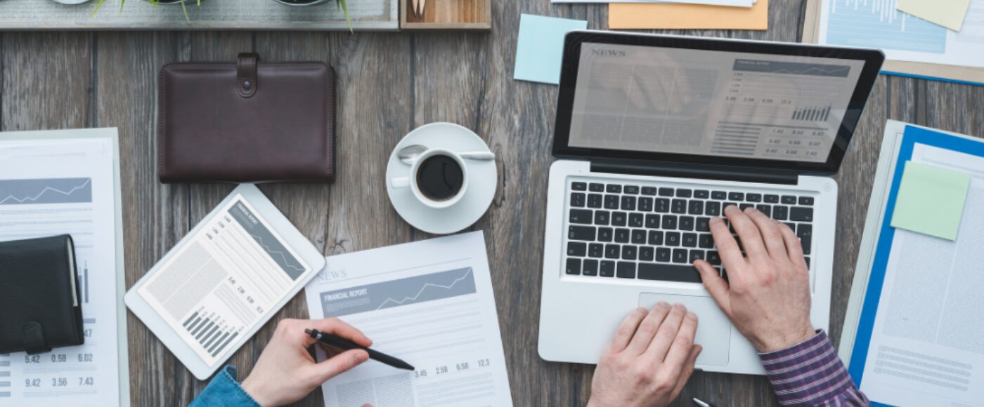 Business owners looking at their statistics