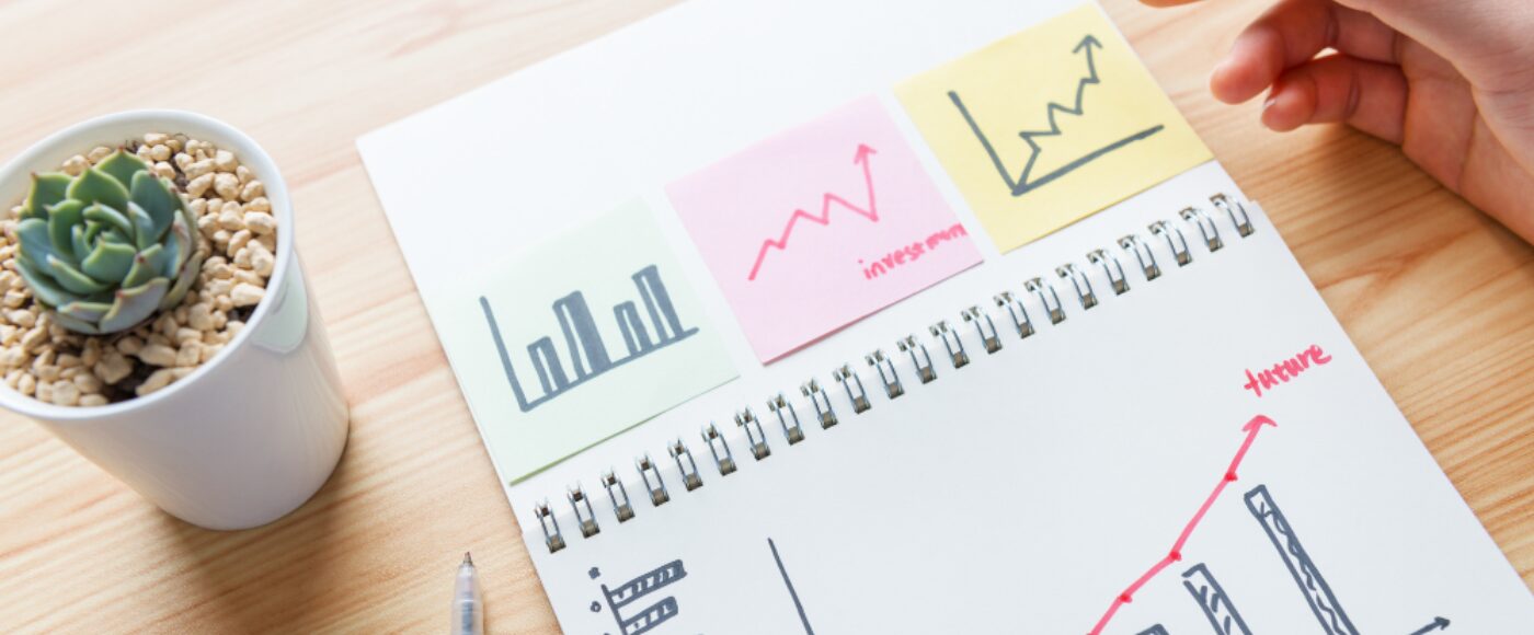 Notepad with an image of graphs indicating growth