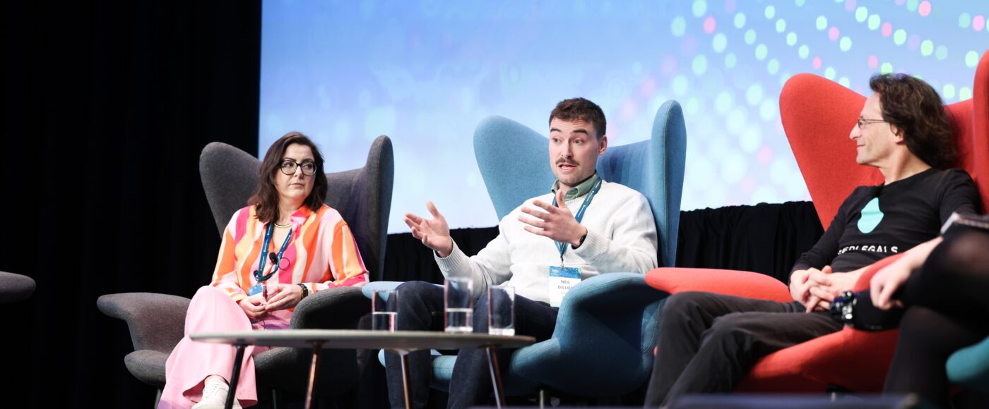 Panel speaking on stage at the VCC 2023 event