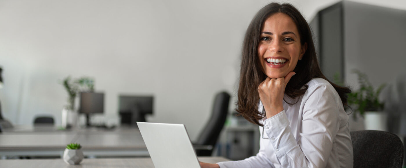 Go 2 Tender Smiling business person with laptop