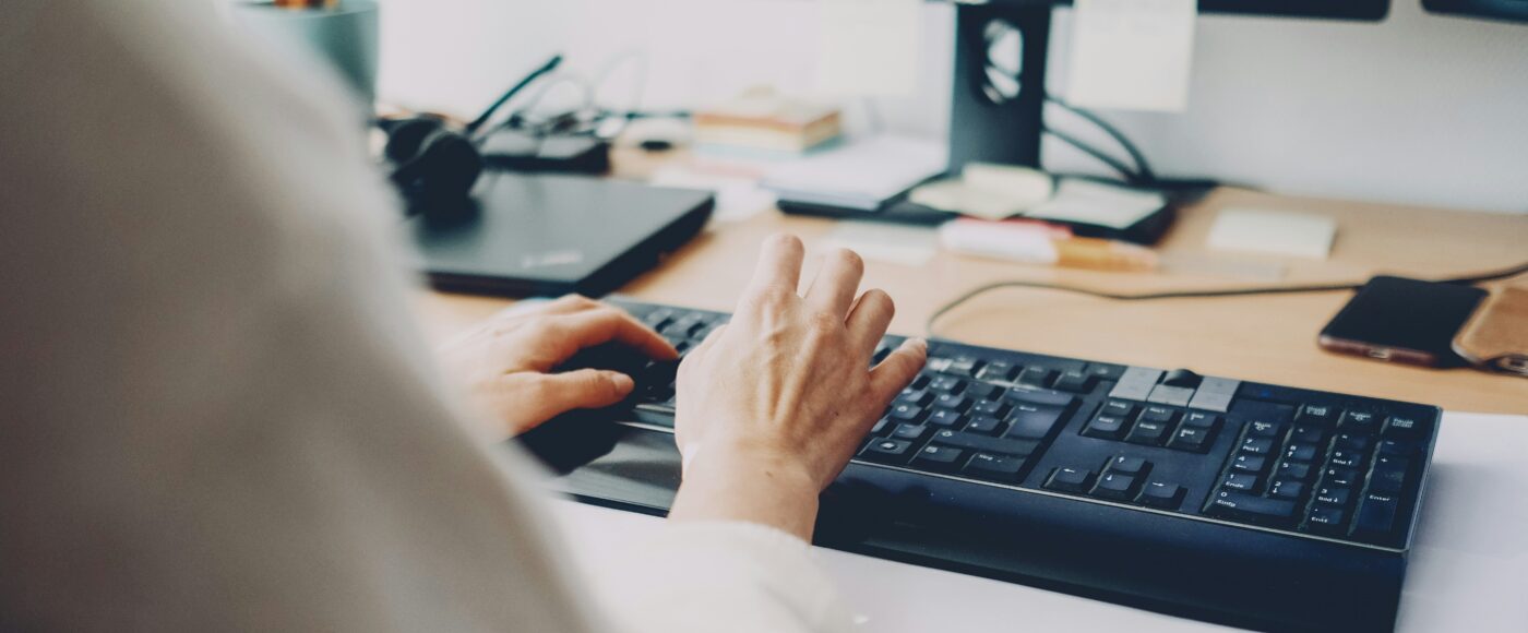 A person typing on a computer