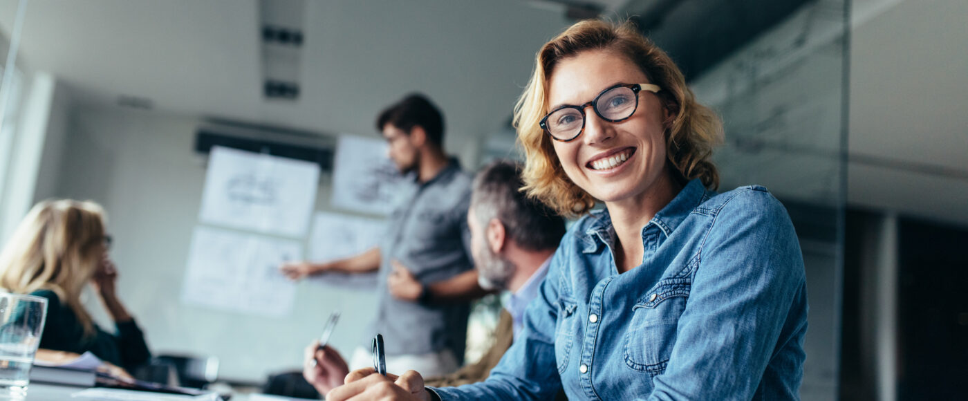 I Stock Business Angel Funding smiling business person looking at camera in meeting