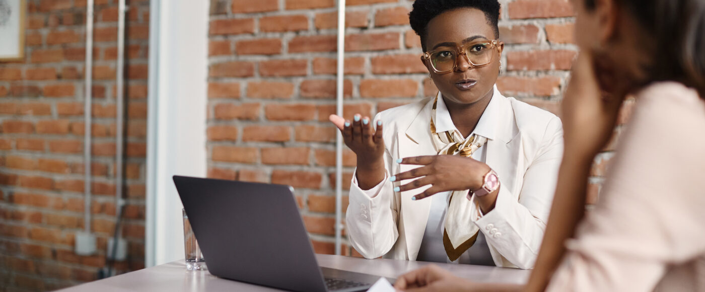 I Stock Go 2 T Masterclasses business professional providing advice while on a laptop