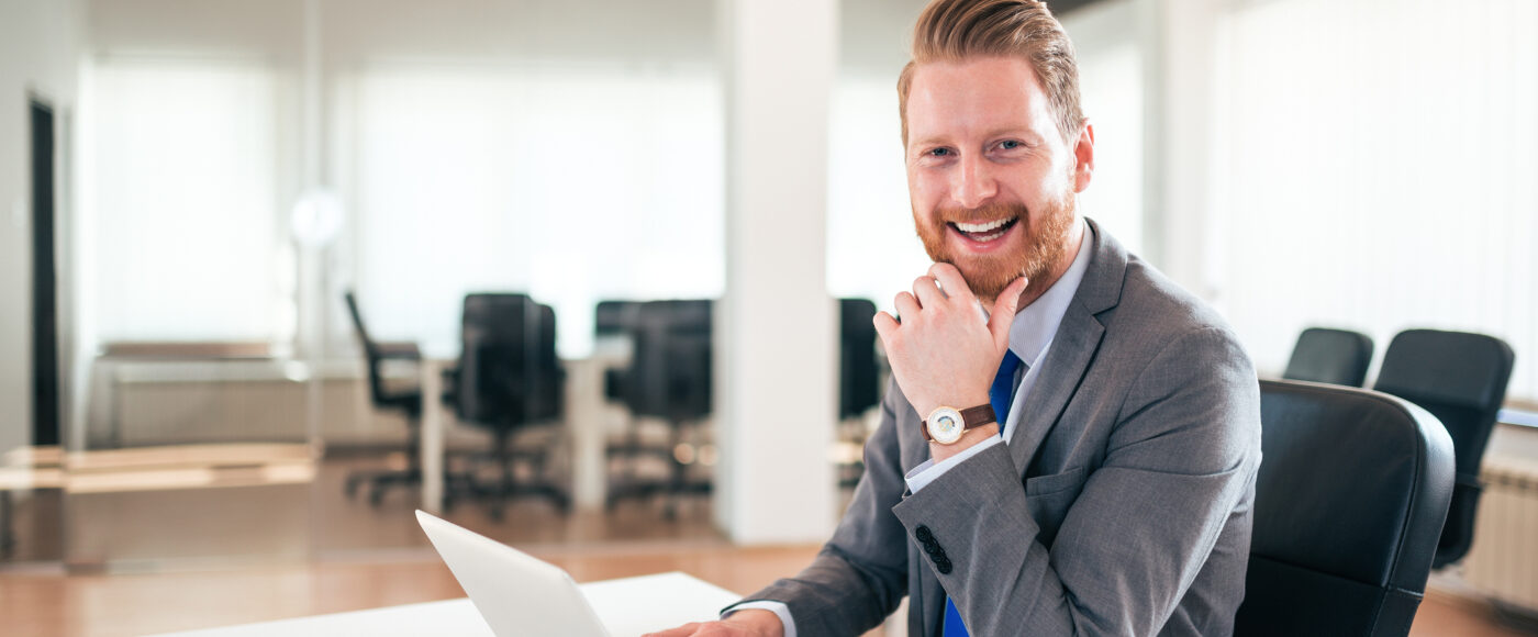 I Stock Growing my sales smiling business professional on laptop