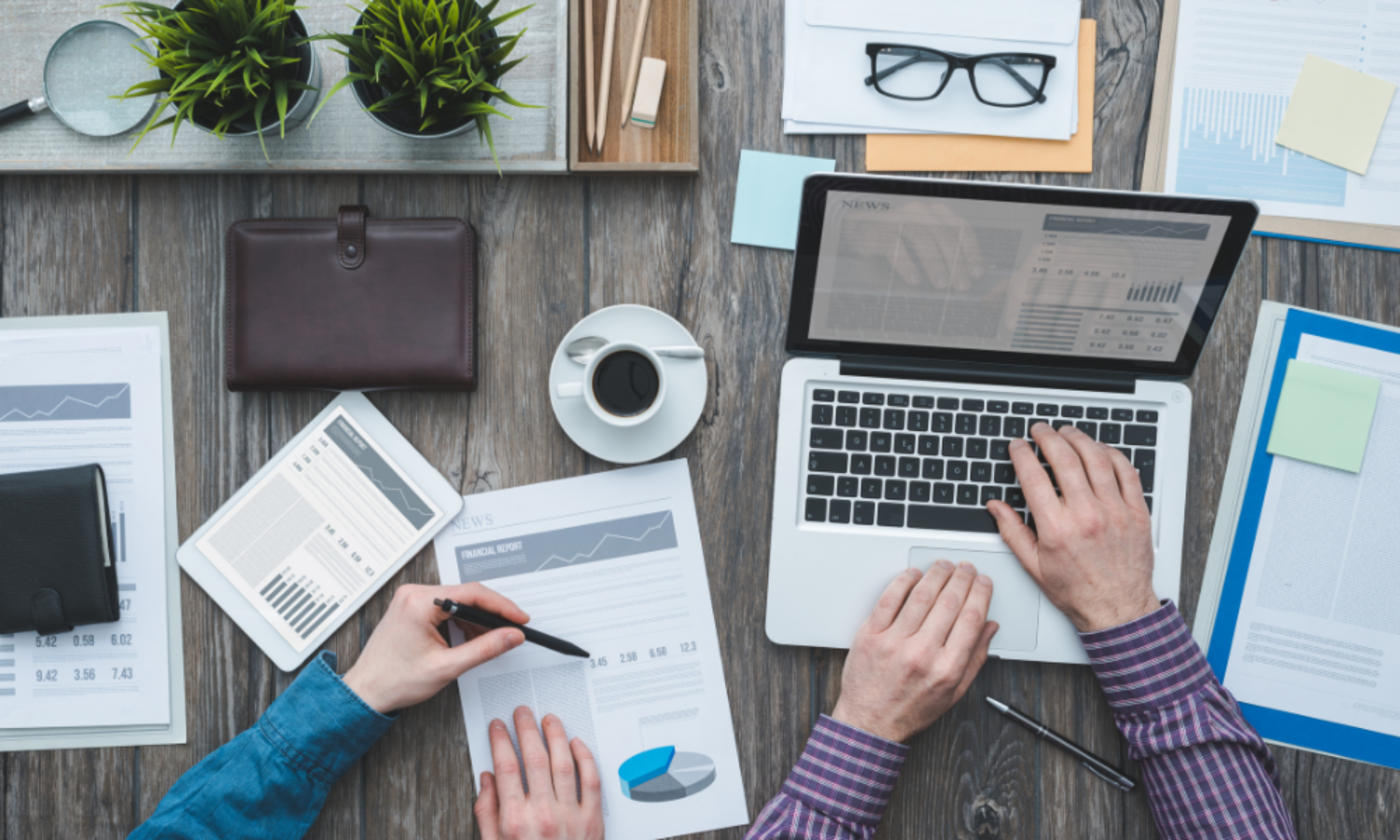 Business owners looking at their statistics