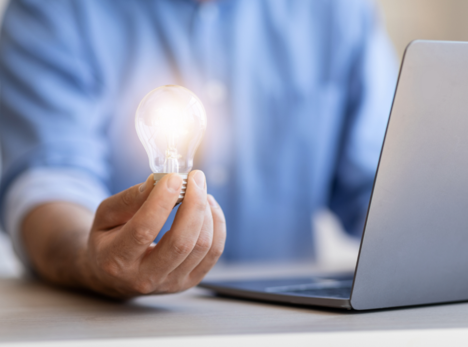 Businessman holding lightbulb