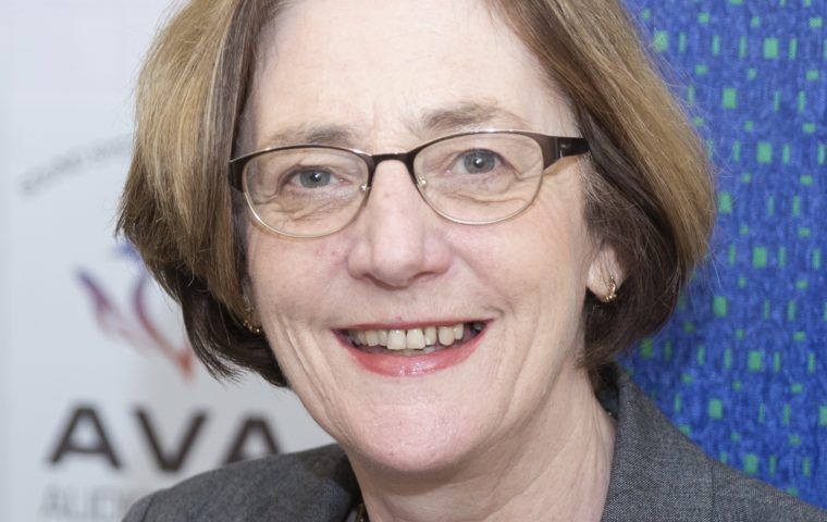 AVA Odilon at desk with glasses cropped