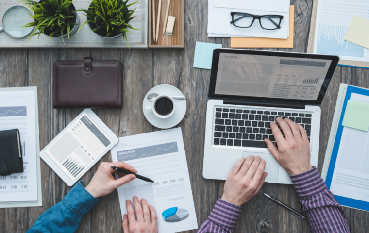 Business owners looking at their statistics