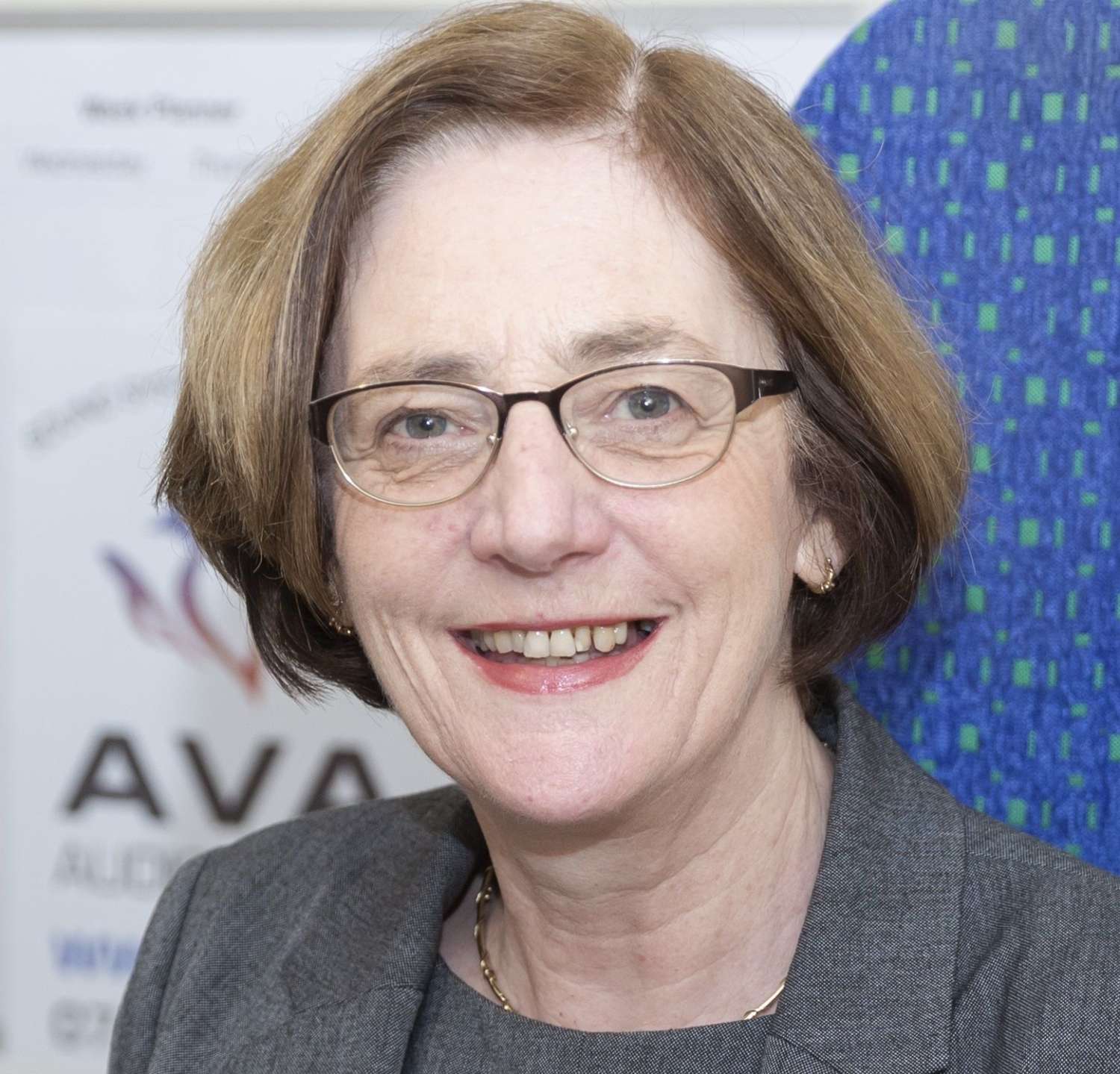 AVA Odilon at desk with glasses cropped