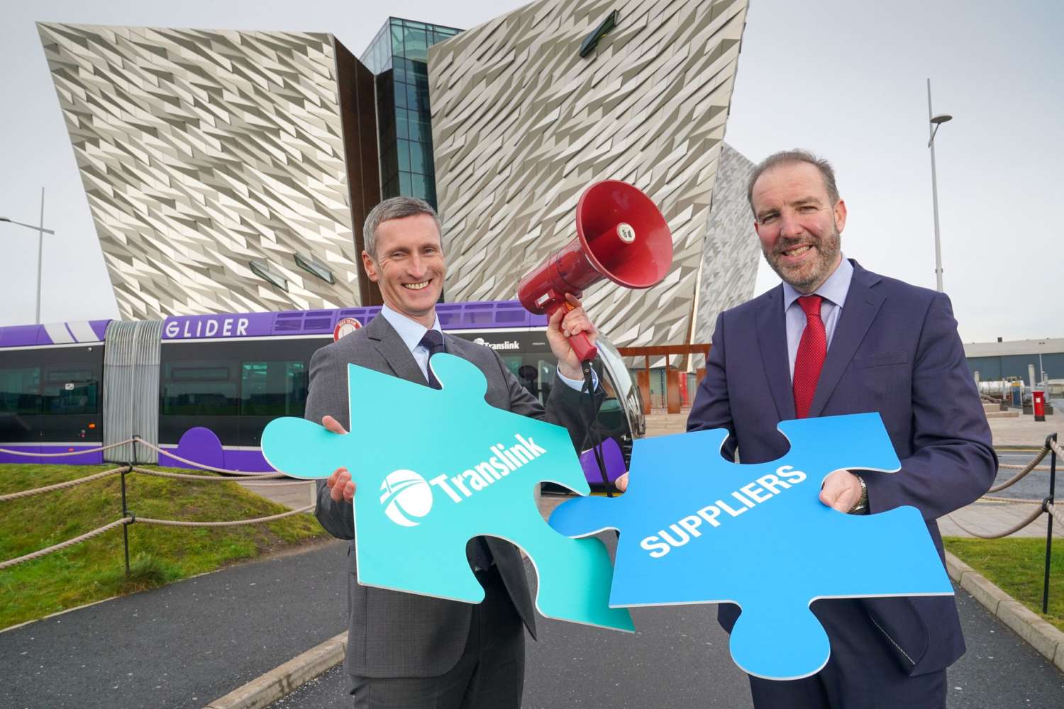 translink suppliers holding jigsaw pieces